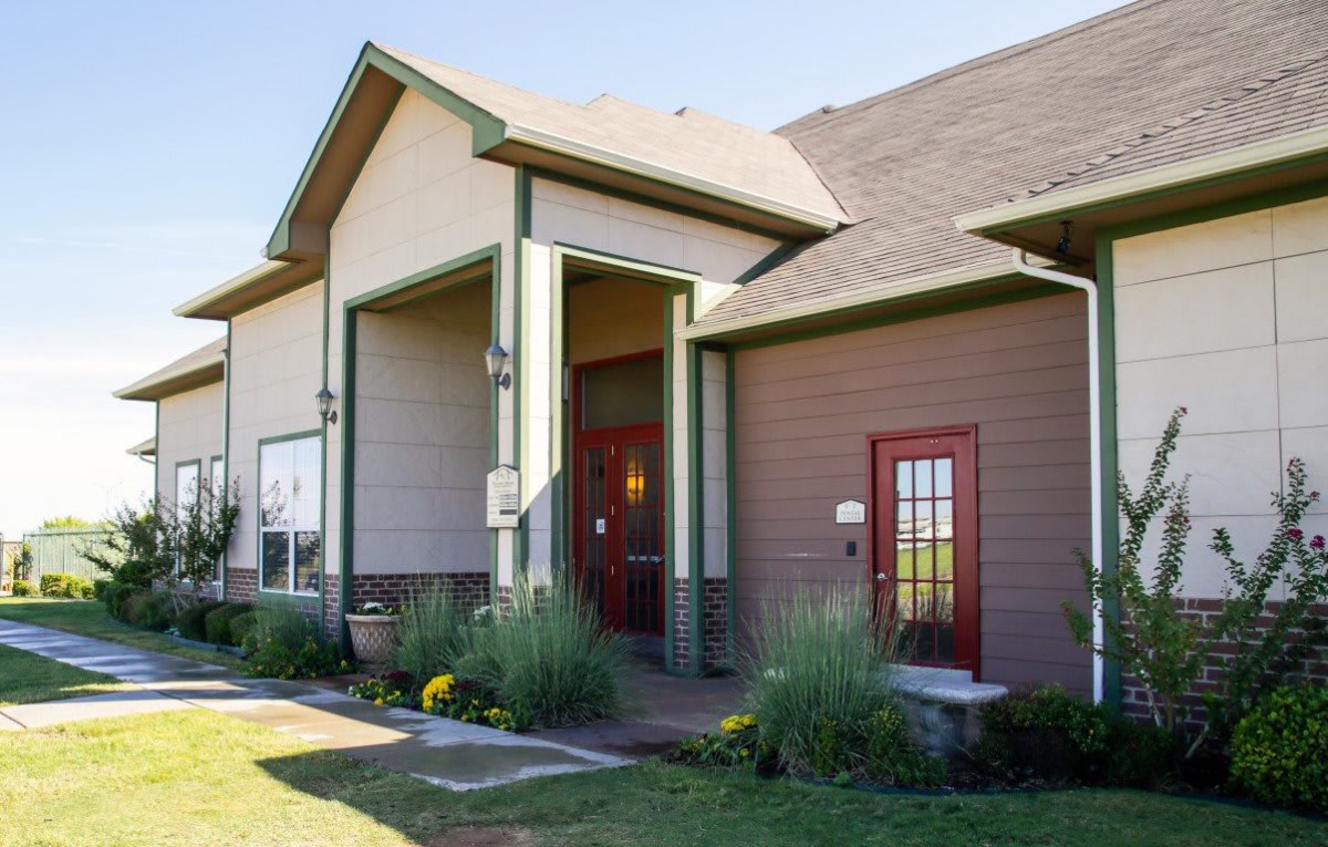 A modern residential house with a well-maintained garden and entrance.