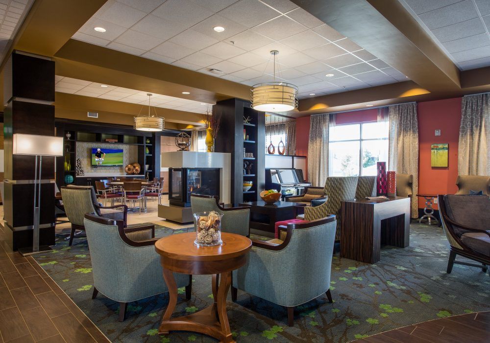 A modern hotel lobby with comfortable seating and stylish decor.