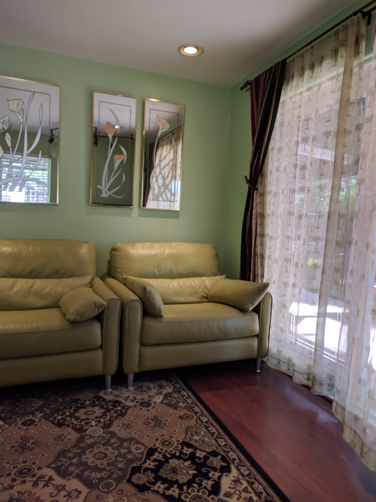 A cozy living room with matching sofas and elegant decor.