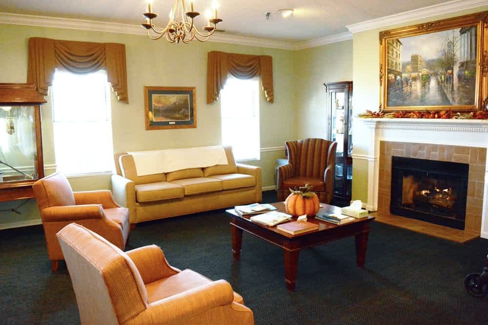 A well-furnished living room with comfortable seating and a cozy fireplace.