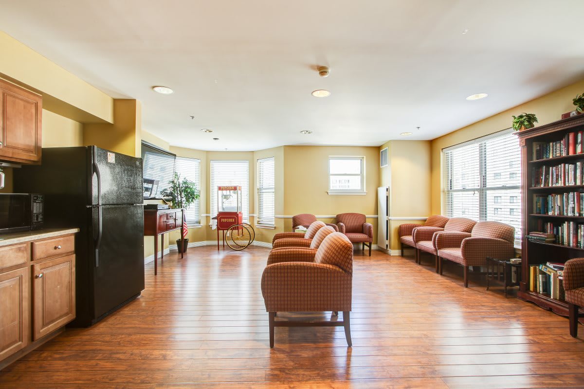 A spacious waiting room with comfortable seating and large windows.