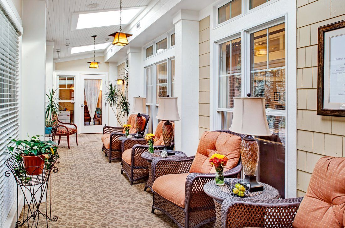 A cozy interior lounge with comfortable seating and decorative lamps.
