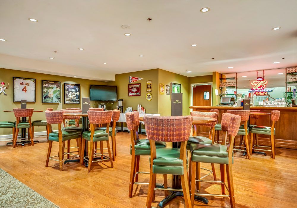 A cozy restaurant interior with a bar and seating area.