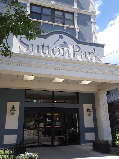 Entrance to Sutton Park showcasing its architectural design and prominent signage.