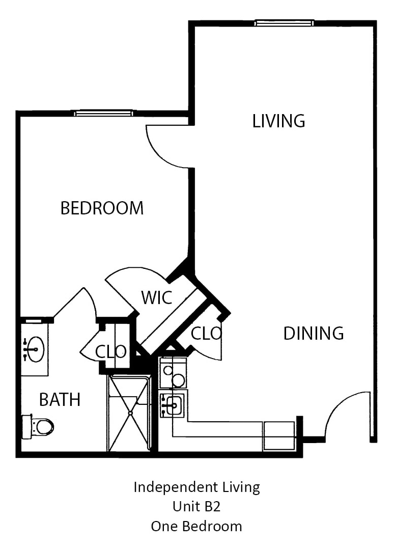 A floor plan showing a one-bedroom apartment with designated living, dining, kitchen, and bathroom areas.