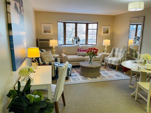A cozy living room with comfortable furniture, warm lighting, and elegant decor.