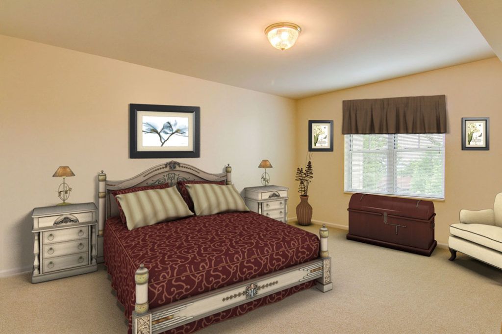 A well-decorated bedroom with a large bed, bedside table, and window.