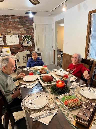 A cozy holiday dinner with loved ones, sharing joy and a festive meal.