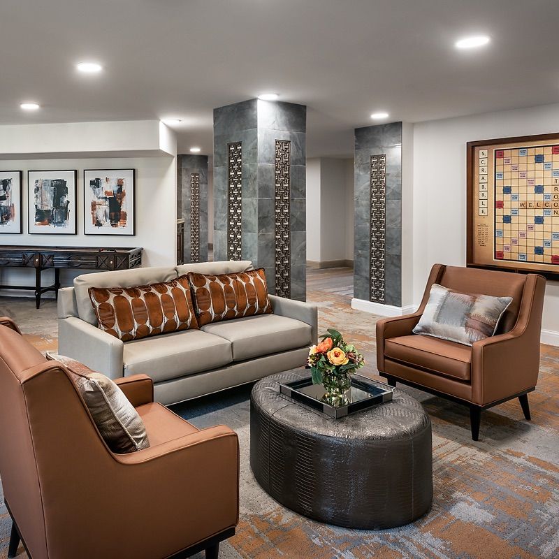 A modern living room with stylish furniture, artwork, and sophisticated decor.