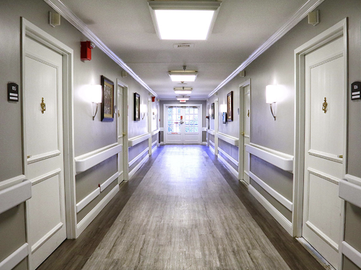 A well-lit, modern hallway featuring multiple doors and a clean design.