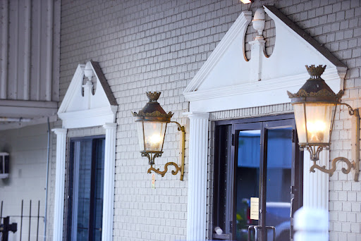 A charming entrance featuring decorative lanterns and classic architectural elements.