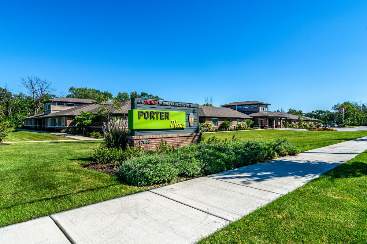 A well-maintained building with a sign reading 'Porter' under a clear blue sky.