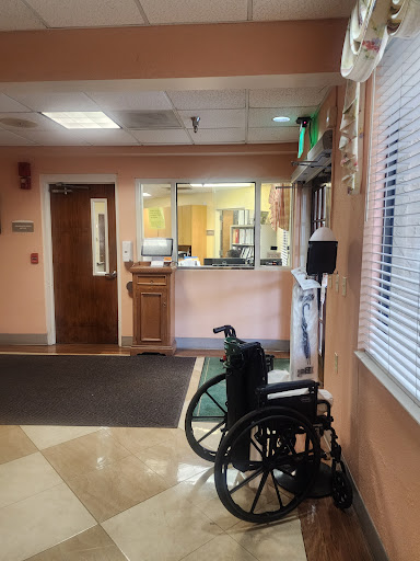 A view of a healthcare facility's waiting area featuring a wheelchair.
