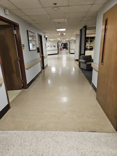 A view of a hospital corridor, showcasing the typical layout and design found in medical facilities.