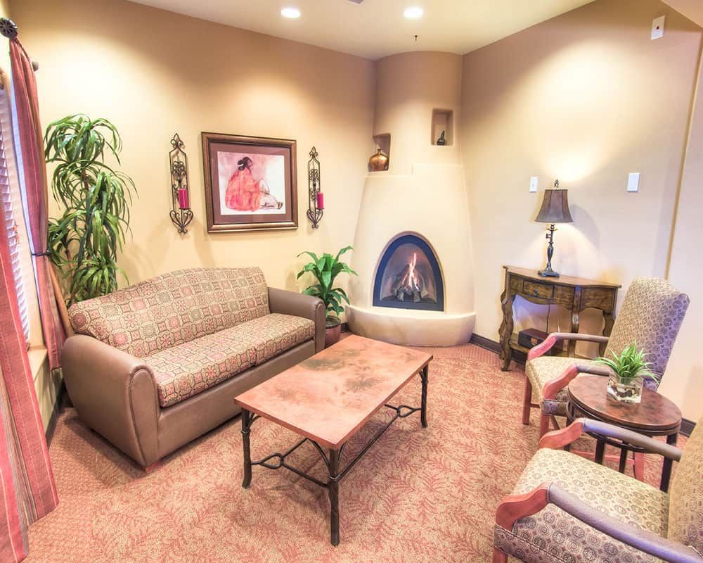 Cozy living room with a fireplace and comfortable seating.