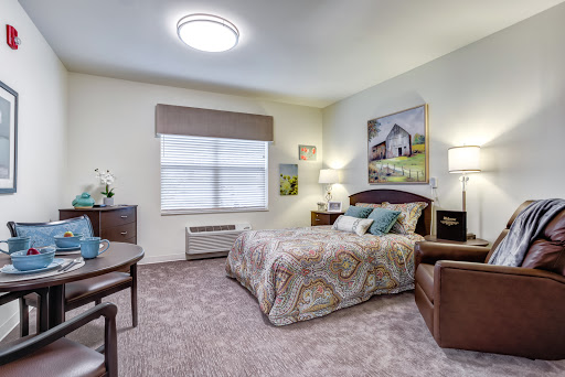 A cozy and modern bedroom featuring a comfortable bed, stylish furniture, and soft lighting.