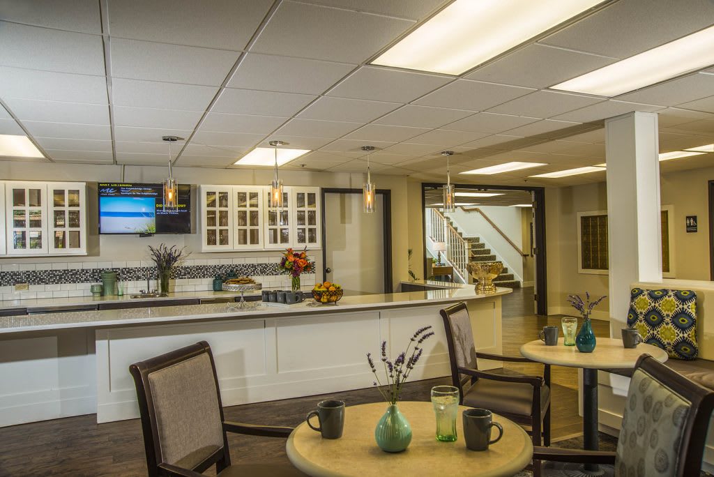 A modern lobby with a reception desk and comfortable seating area.