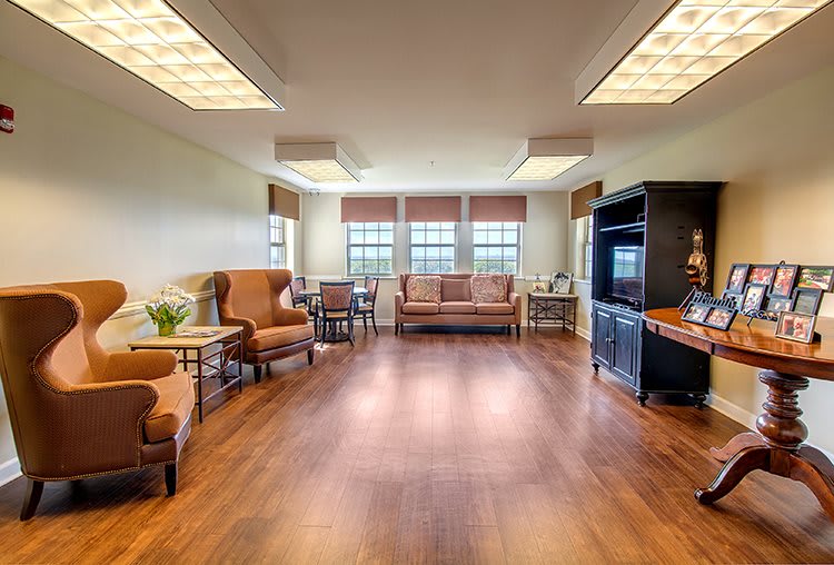 A spacious living room with cozy furniture and ample natural light.