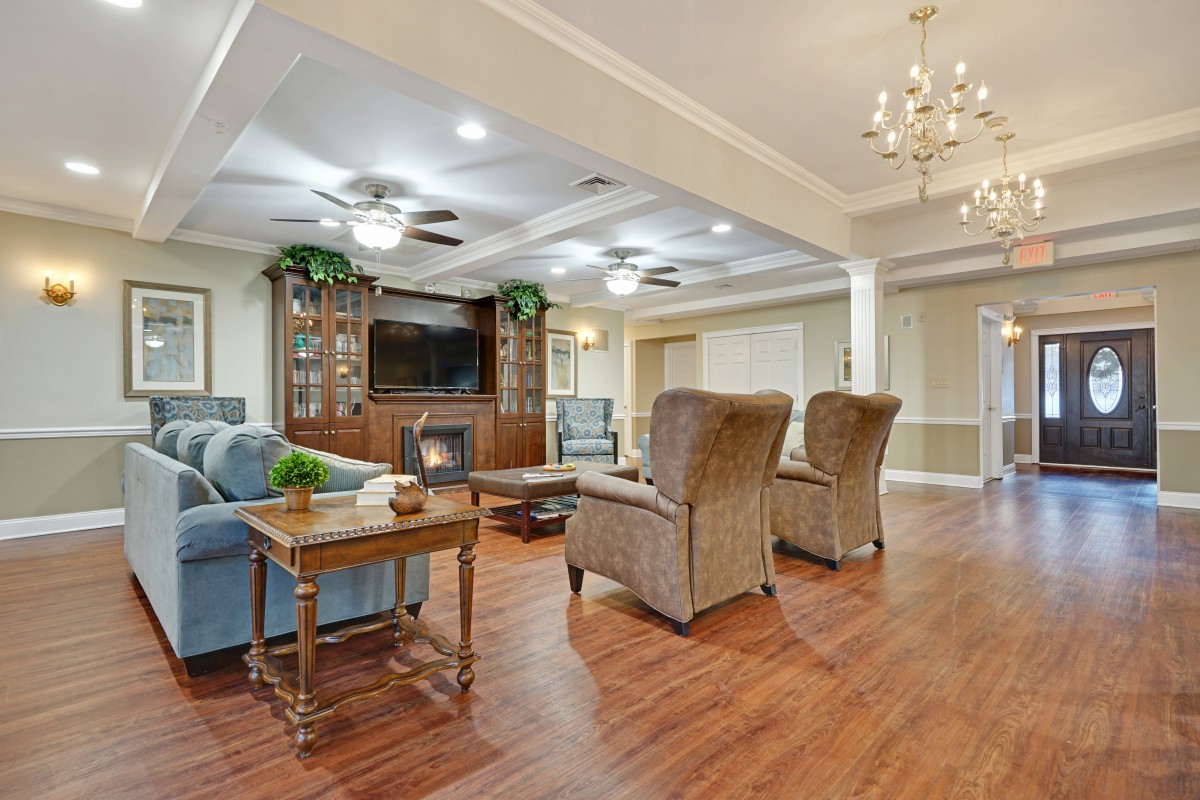 A spacious living room with elegant furniture and a cozy ambiance.