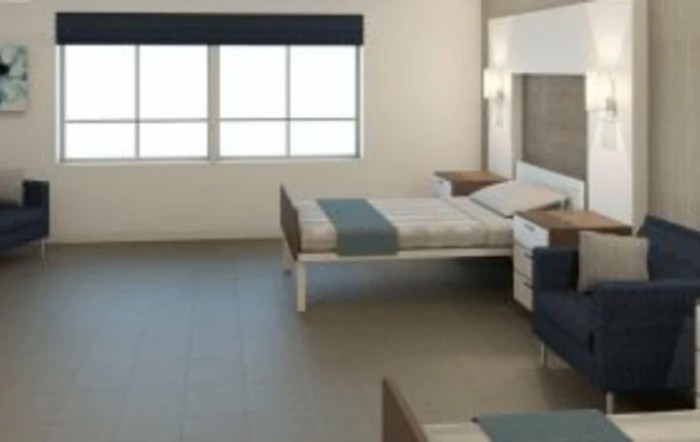 A modern, minimalist bedroom with simple furnishings and a large window.