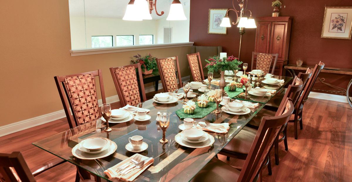 An elegantly set dining table ready for a formal dinner gathering.