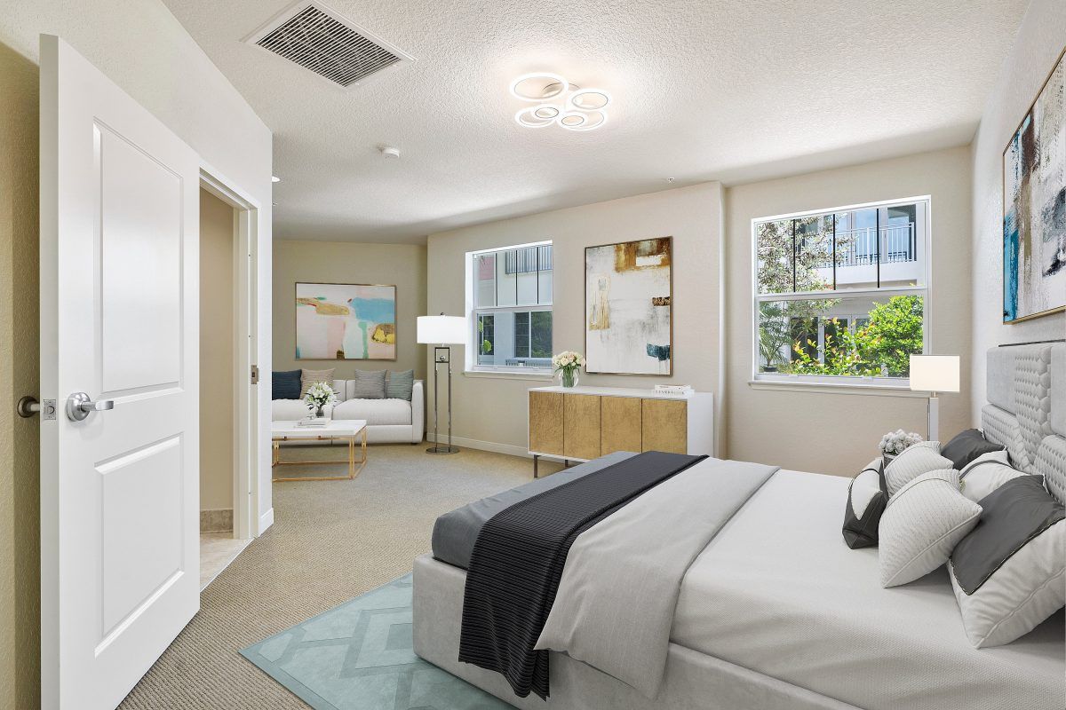 A modern, well-lit bedroom with stylish decor and comfortable furnishings.