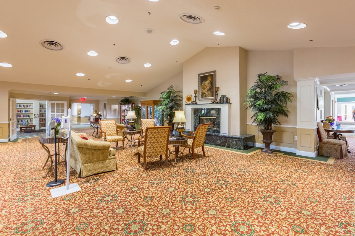A spacious lobby with elegant furnishings and a warm, inviting atmosphere.