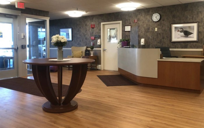 A welcoming reception area with a desk and decorative table centerpiece.