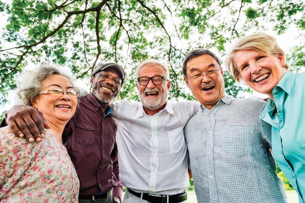 A group of happy seniors enjoying time together outdoors.