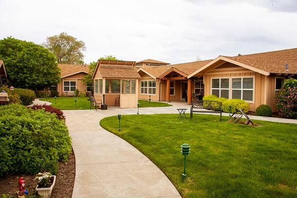 A beautiful house with a well-maintained lawn and garden.