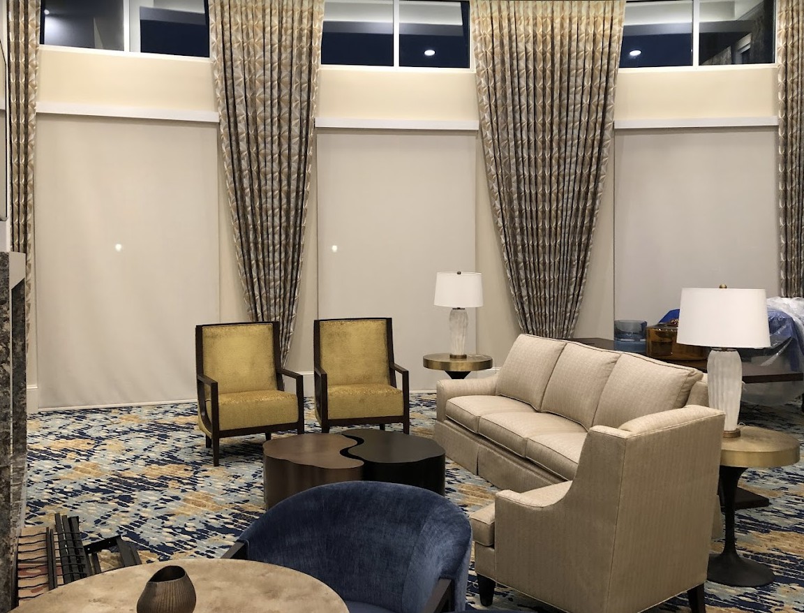 A sophisticated living room featuring elegant furniture and decor elements.