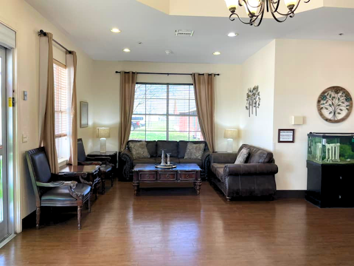 A cozy and well-lit living room featuring leather furniture and elegant decor.