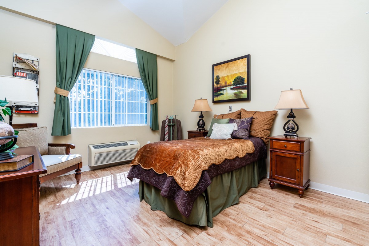 A cozy bedroom with elegant decor and natural light.
