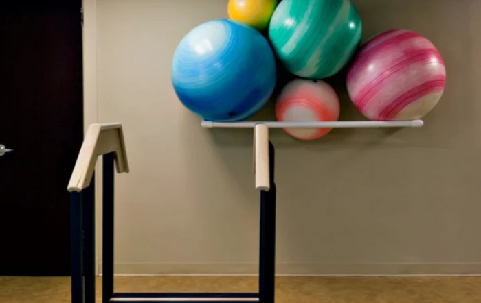 A modern art installation featuring colorful balls and geometric shapes.
