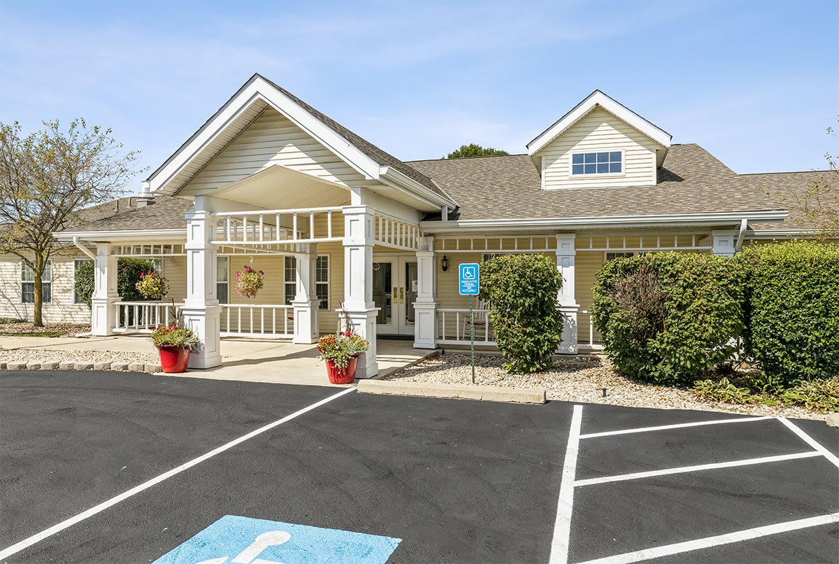 A residential building with a welcoming entrance and designated parking spaces.
