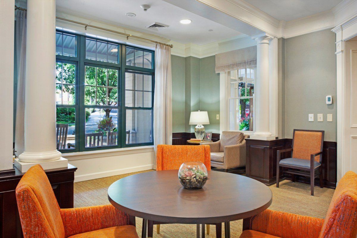 A cozy living room with comfortable seating and a large window.
