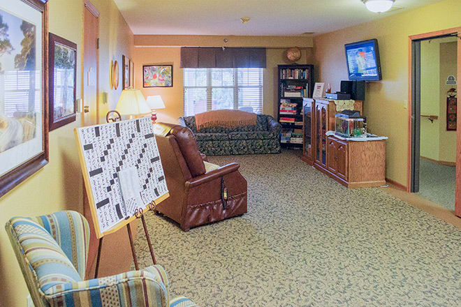 A cozy living room with comfortable seating and a television.