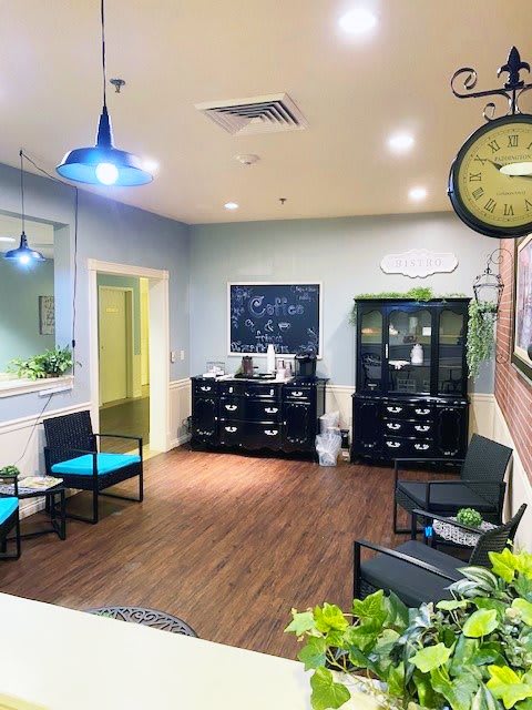 A cozy waiting room with modern decor and comfortable seating.