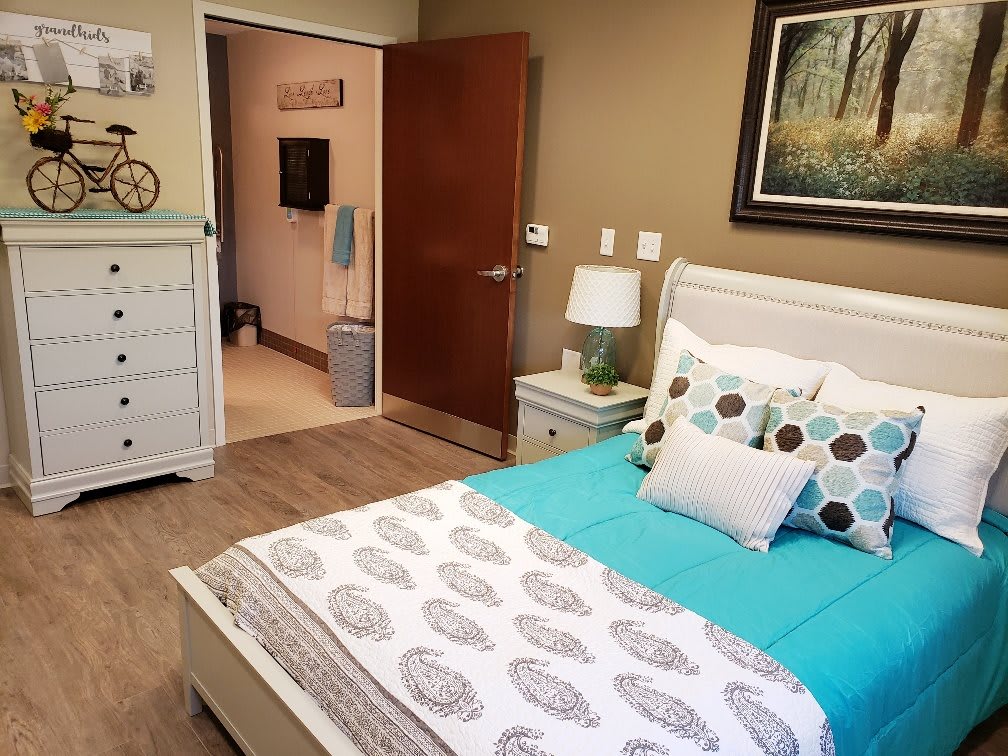 A cozy bedroom with inviting decor and neutral tones.