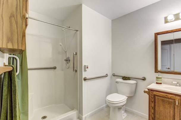 A modern, accessible bathroom with a shower and toilet equipped with grab bars.