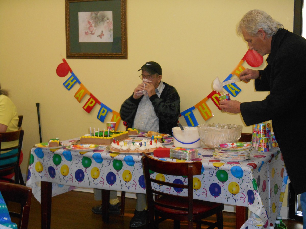 A birthday celebration with cake and decorations in a festive setting.