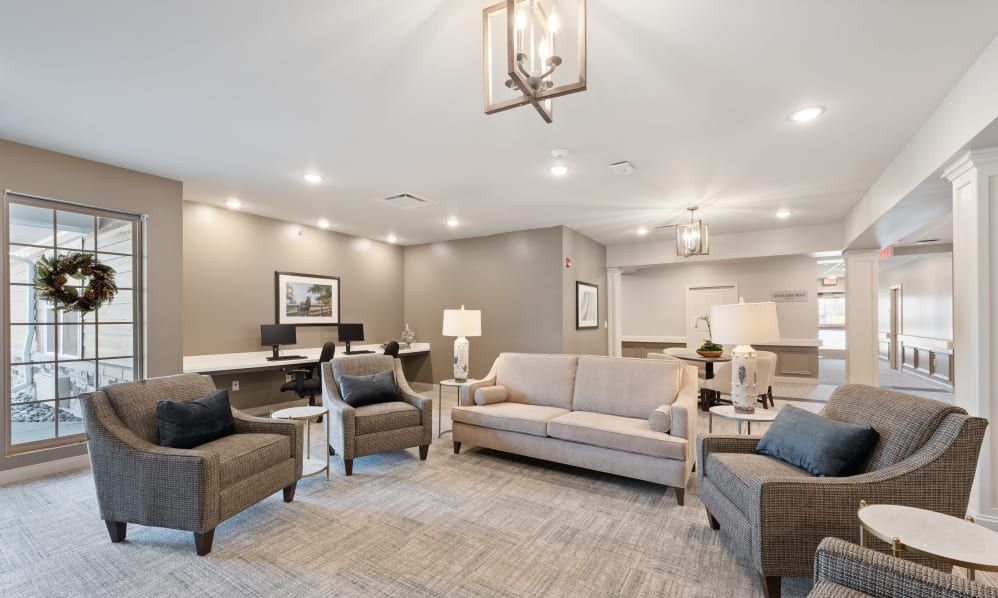 A modern living room with comfortable seating and elegant lighting.