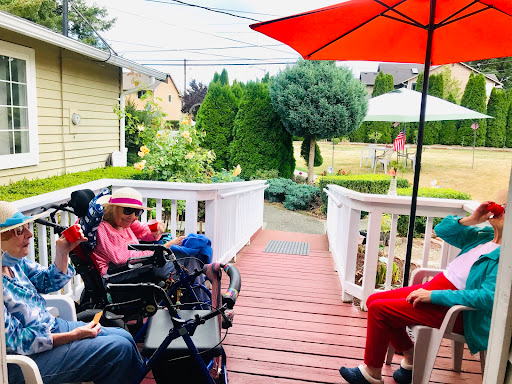 A peaceful afternoon gathering on the patio, enjoying the company and the shade.