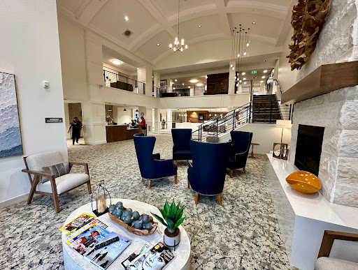 A spacious and elegantly designed hotel lobby with modern furnishings and a welcoming atmosphere.