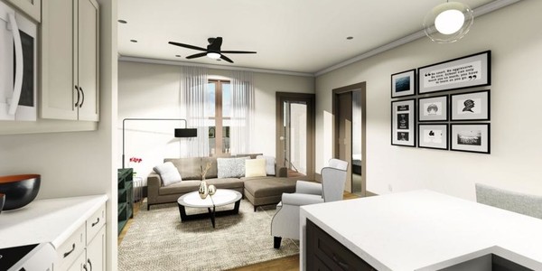 A modern living room with a cozy seating area and minimalist decor.