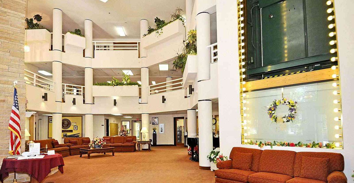 A modern lobby with comfortable seating and greenery.
