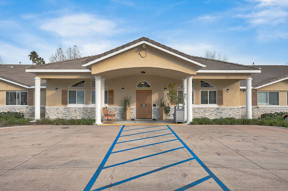 A well-maintained building with a welcoming entrance and accessible parking.