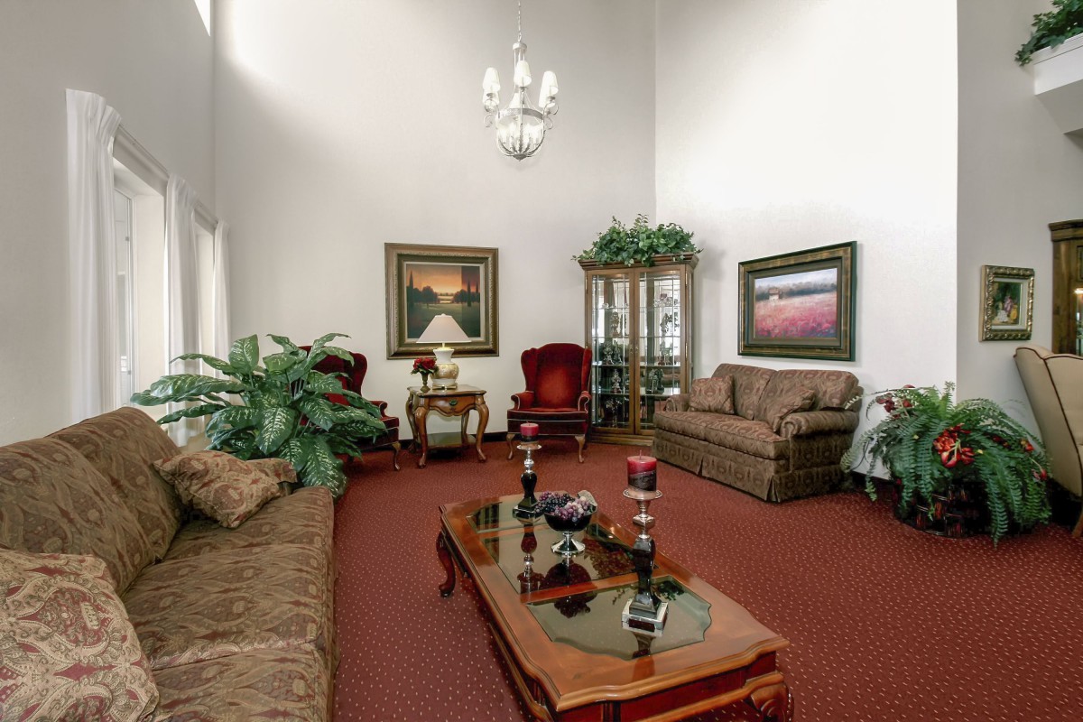 A classic living room with elegant furniture and artwork.