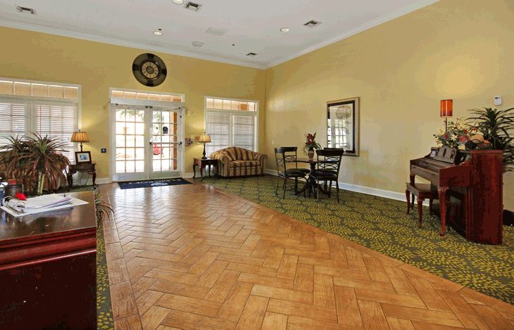 Spacious lobby area with seating and decorative elements.
