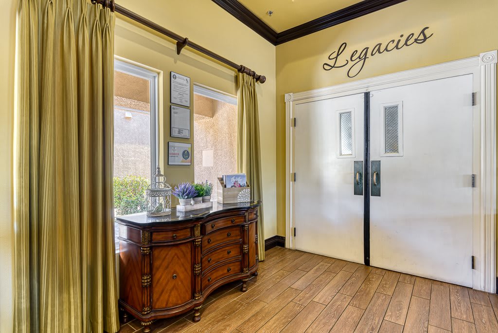 A stylish hallway entrance with elegant decor and wooden furniture.